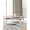 Kanwyn Ottoman White Wash Cocktail Table with Tufted Brown Leather Cushion Top